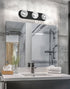 Bathroom vanity with mirror, light fixture, and toiletries.