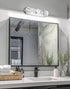 Bathroom vanity with mirror, sink, and decorative elements.