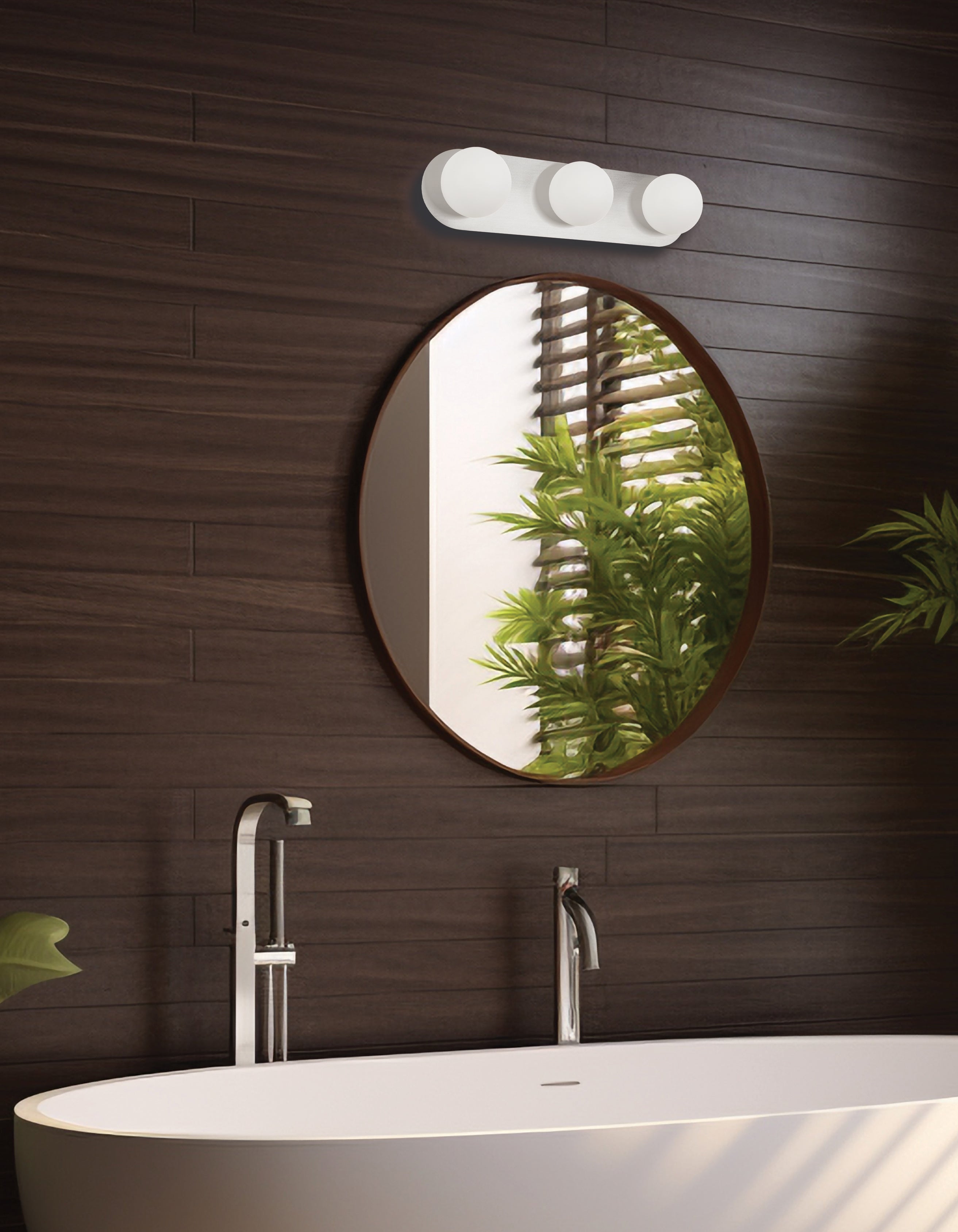 Round mirror on a wooden wall with a modern bathroom setup
