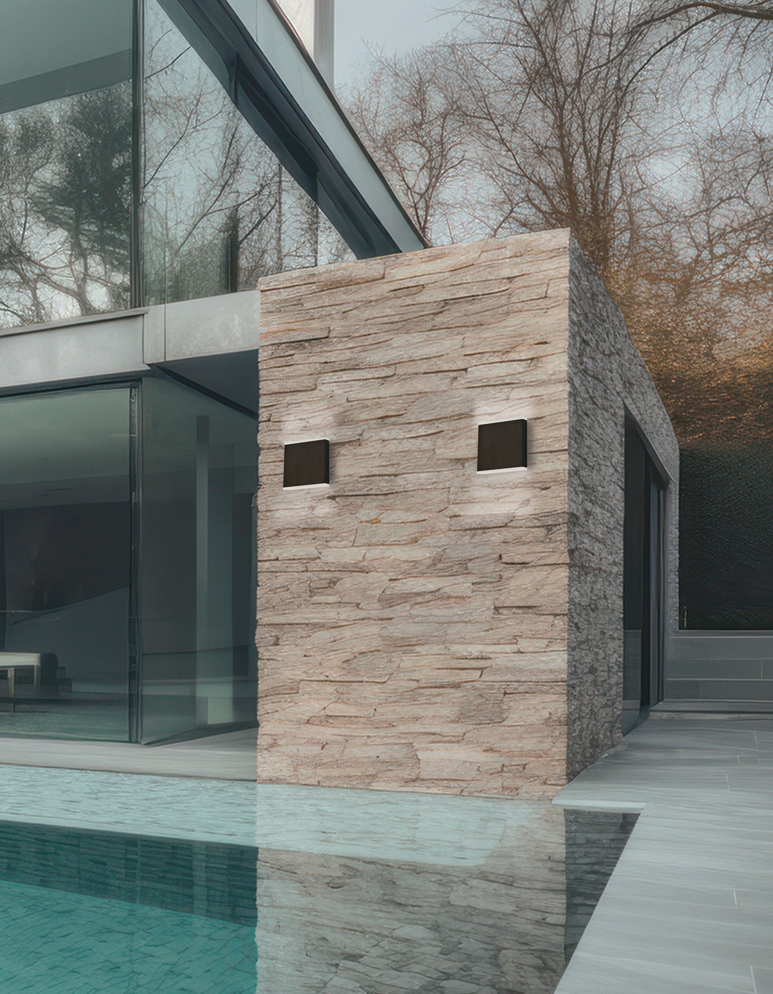 Modern building with stone facade next to a pool