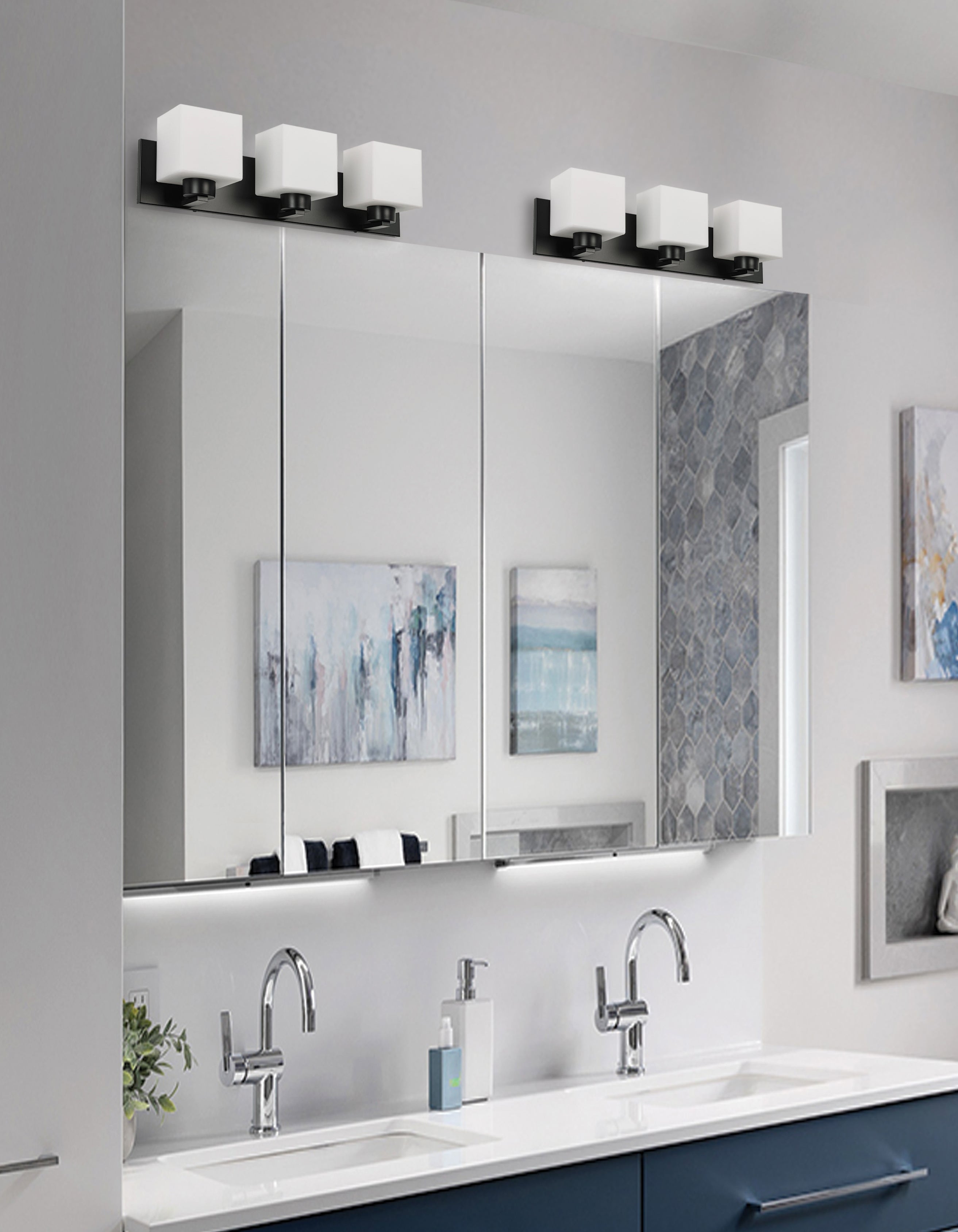 Bathroom vanity with mirrors, lights, and decor