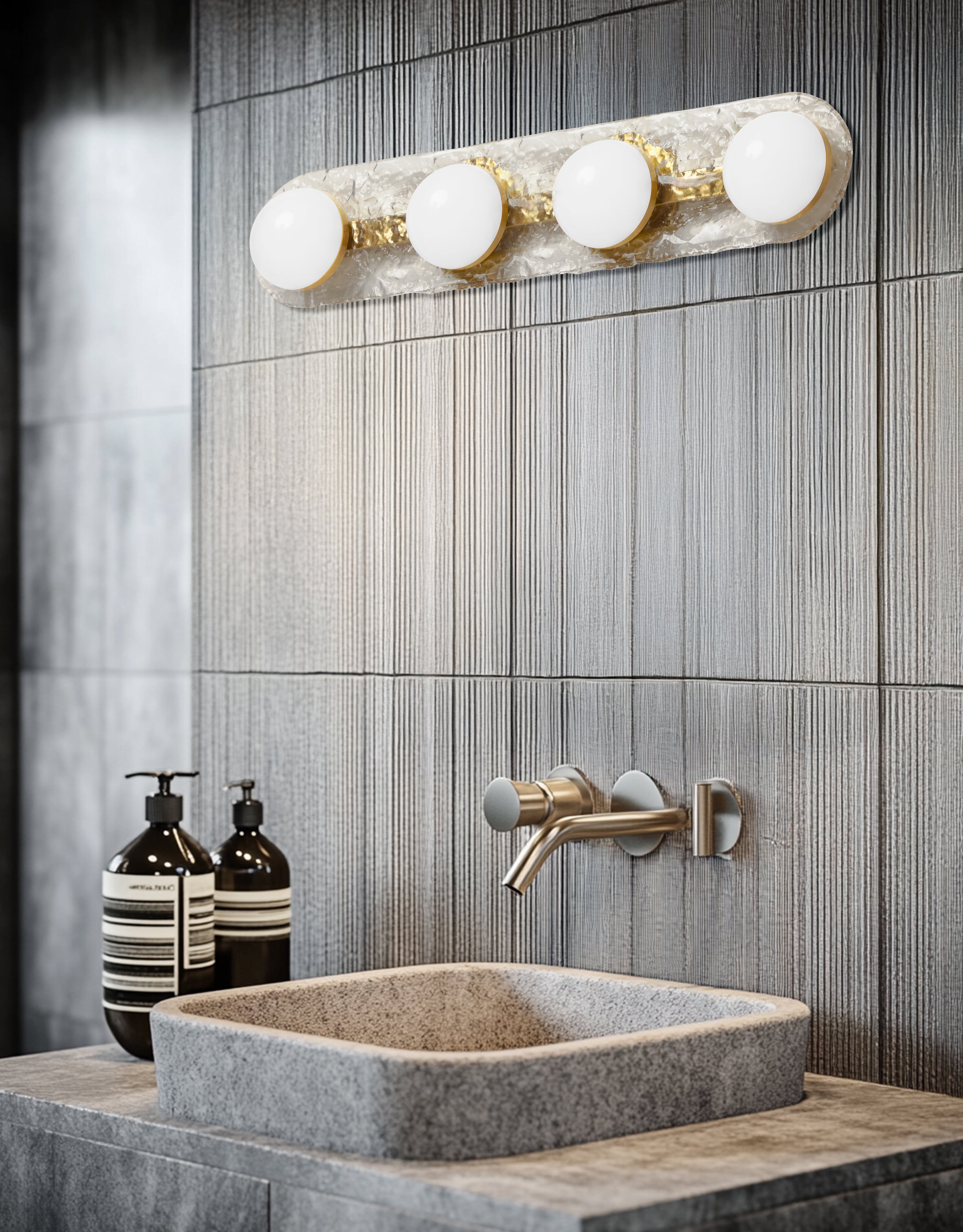 Bathroom vanity with a sink, faucet, and wall-mounted light fixture.